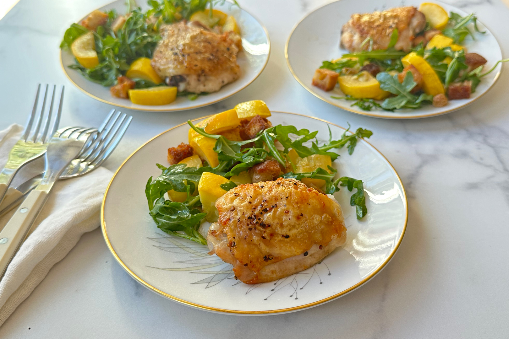 Plated chicken with arugula